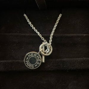 Hermès necklace in sterling silver with pendant